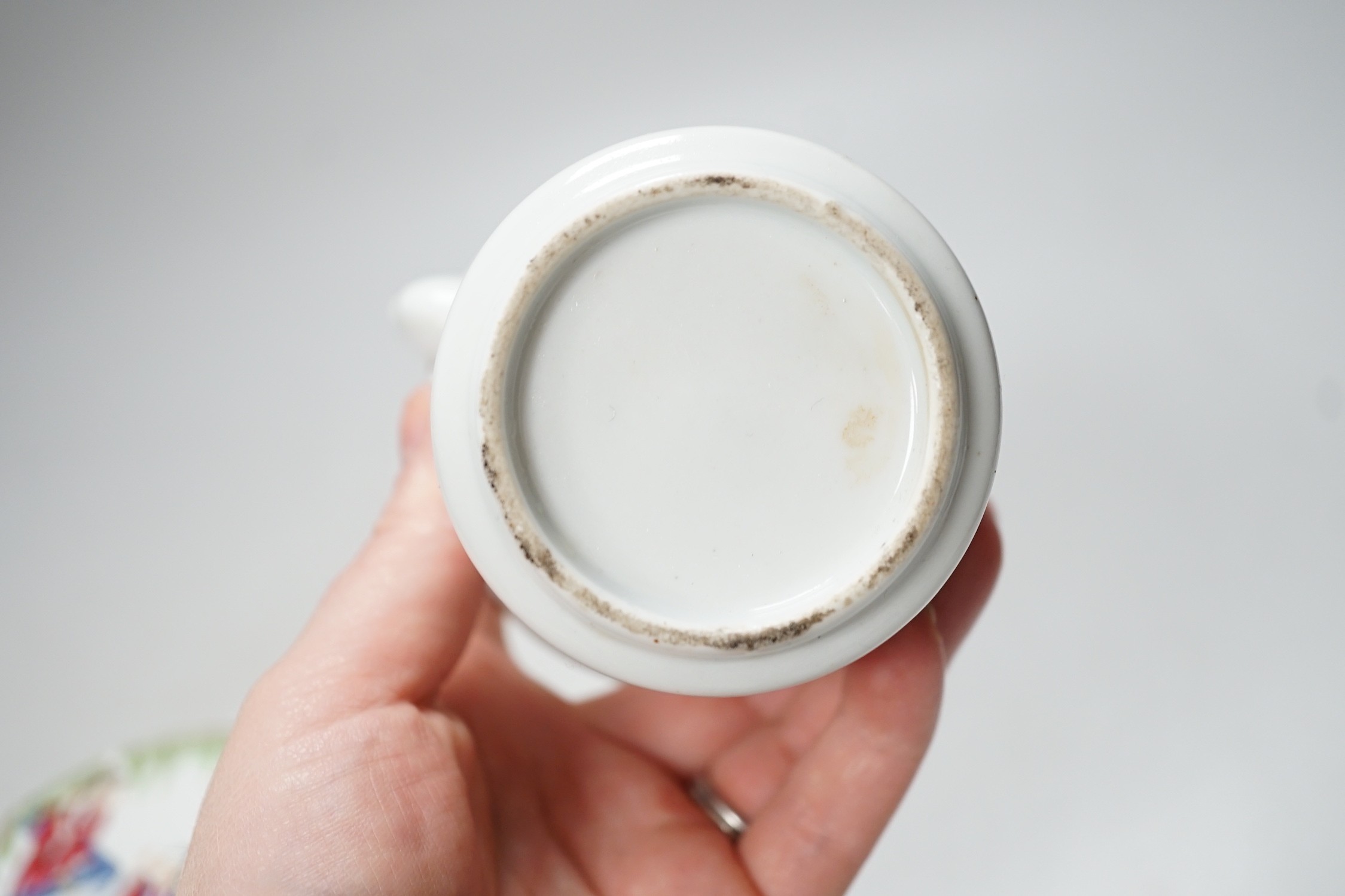 A Chinese famille rose teapot and a cover, together with a similar dish. 12cm tall
